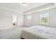 Bright bedroom features two large windows and neutral color palette at 116 Hayfield Dr, Lillington, NC 27546