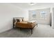 Bedroom features natural light, plush carpeting, and neutral color palette at 116 Hayfield Dr, Lillington, NC 27546