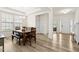 Open-concept dining room with modern furnishings, plenty of natural light, and wood-look floors at 116 Hayfield Dr, Lillington, NC 27546