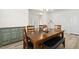 Cozy dining room showcasing modern decor, wood-look floors, and natural light at 116 Hayfield Dr, Lillington, NC 27546