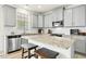 Modern kitchen featuring light gray cabinetry, stone countertops, and stainless steel appliances at 116 Hayfield Dr, Lillington, NC 27546