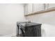 Modern laundry room features front load washer and dryer and white cabinets for storage at 116 Hayfield Dr, Lillington, NC 27546