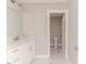 Bathroom with a single sink, white marble floors, and a separate toilet room at 117 Knight Rd Rd, Broadway, NC 27505