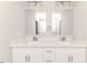 Modern bathroom vanity featuring double sinks, elegant hardware, and plenty of storage space at 117 Knight Rd Rd, Broadway, NC 27505