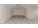A spacious, empty bedroom with wood-look flooring and a ceiling fan at 117 Knight Rd Rd, Broadway, NC 27505