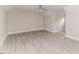 Large empty living area featuring wood-look flooring, a ceiling fan, and recessed lighting at 117 Knight Rd Rd, Broadway, NC 27505