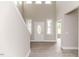 Bright, two-story foyer features hardwood floors, a decorative front door, and access to another room at 117 Knight Rd Rd, Broadway, NC 27505