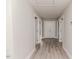 Bright hallway with grey walls and white trim leading to a set of double doors at 117 Knight Rd Rd, Broadway, NC 27505