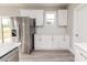Modern kitchen with stainless steel appliances and white cabinets at 117 Knight Rd Rd, Broadway, NC 27505