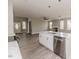Bright living area with wood floors, fireplace, and an open concept kitchen at 117 Knight Rd Rd, Broadway, NC 27505