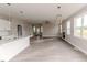 Spacious living area with wood floors, fireplace, and an open view to kitchen at 117 Knight Rd Rd, Broadway, NC 27505