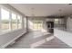 Bright living area with wood floors, large windows, and an adjacent deck at 117 Knight Rd Rd, Broadway, NC 27505
