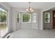 Inviting dining room with chandelier, natural light and a view of the deck area at 1228 Shakentown St, Knightdale, NC 27545