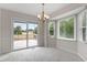 Well-lit dining area features sliding door access to the wooden deck and backyard at 1228 Shakentown St, Knightdale, NC 27545
