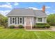 Classic home featuring a well-manicured lawn and established landscaping, offering inviting curb appeal at 1228 Shakentown St, Knightdale, NC 27545