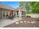 Beautifully landscaped backyard with patio and screen porch at 125 Greenway Landing Lndg, Chapel Hill, NC 27516