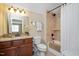 Bathroom with granite counter, shower, tub and linen closet at 125 Greenway Landing Lndg, Chapel Hill, NC 27516