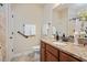 Well-lit bathroom featuring a granite countertop, modern fixtures, and neutral tile at 125 Greenway Landing Lndg, Chapel Hill, NC 27516