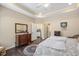 Bright bedroom with hardwood floors, dresser, and ensuite bathroom at 125 Greenway Landing Lndg, Chapel Hill, NC 27516