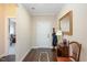 Inviting foyer featuring dark wood floors, a coat rack, and an elegant mirror at 125 Greenway Landing Lndg, Chapel Hill, NC 27516