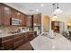 Gourmet kitchen with dark wood cabinets, stainless appliances, and granite countertops at 125 Greenway Landing Lndg, Chapel Hill, NC 27516
