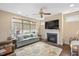 Inviting living room featuring a fireplace, comfortable seating, and plenty of natural light at 125 Greenway Landing Lndg, Chapel Hill, NC 27516