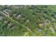 Overhead view of neighborhood with large lot homes amongst the trees at 1301 King Cross Ct, Raleigh, NC 27614