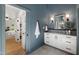 Stylish bathroom features a modern vanity and a glimpse of the bedroom at 1301 King Cross Ct, Raleigh, NC 27614