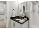 Bathroom featuring a granite vanity, framed mirror and walk-in shower at 1301 King Cross Ct, Raleigh, NC 27614