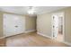 Spacious bedroom with hardwood floors, a ceiling fan, and large closets at 1301 King Cross Ct, Raleigh, NC 27614