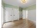 Spacious room with hardwood floors, fresh paint, white trim and three large storage areas at 1301 King Cross Ct, Raleigh, NC 27614