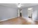 Light-filled bedroom with hardwood floors leading to an ensuite bathroom at 1301 King Cross Ct, Raleigh, NC 27614