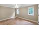 Inviting bedroom with hardwood floors and natural light from two windows at 1301 King Cross Ct, Raleigh, NC 27614