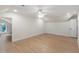 Spacious bonus room featuring hardwood floors, recessed lighting, a ceiling fan, and a doorway leading to another room at 1301 King Cross Ct, Raleigh, NC 27614