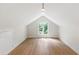 Bright bonus room features hardwood floors, recessed lights, and a window with natural light at 1301 King Cross Ct, Raleigh, NC 27614