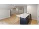 Bonus room with a bar area, hardwood floors, and recessed lighting at 1301 King Cross Ct, Raleigh, NC 27614