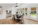 Bright dining area featuring a modern light fixture, with views of the private backyard at 1301 King Cross Ct, Raleigh, NC 27614