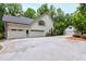 Spacious home exterior featuring a three car garage and additional detached two car garage at 1301 King Cross Ct, Raleigh, NC 27614