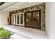 Charming entryway with stone accents and a sturdy double door entrance, painted brick and porch at 1301 King Cross Ct, Raleigh, NC 27614