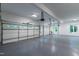 Spacious three car garage with epoxy floor and side entrance door at 1301 King Cross Ct, Raleigh, NC 27614
