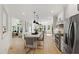 Spacious kitchen featuring an island, stainless steel appliances, and an open layout with access to living spaces at 1301 King Cross Ct, Raleigh, NC 27614