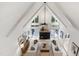 Bright living room features high vaulted ceilings, a fireplace, and modern furniture at 1301 King Cross Ct, Raleigh, NC 27614