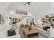 Bright, open-concept living room with vaulted ceilings, a staircase, and hardwood floors at 1301 King Cross Ct, Raleigh, NC 27614