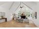 Spacious living room boasting vaulted ceiling, hardwood floors, and ample natural light at 1301 King Cross Ct, Raleigh, NC 27614