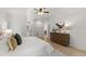 Light-filled main bedroom offers hardwood floors, neutral tones, and stylish decor at 1301 King Cross Ct, Raleigh, NC 27614