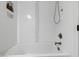 Modern bathroom featuring a tiled shower and tub combination with white subway tile at 1301 King Cross Ct, Raleigh, NC 27614