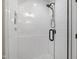Bathroom shower with white subway tiles, a glass door, and a shower head at 1301 King Cross Ct, Raleigh, NC 27614