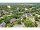Aerial view of homes in a lush neighborhood with mature trees, showcasing its desirable location at 14 Marigold Pl, Durham, NC 27705