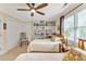 Inviting bedroom featuring two twin beds, a built-in bookcase, and natural lighting at 14 Marigold Pl, Durham, NC 27705