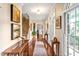Inviting foyer featuring hardwood floors, elegant staircase, and stylish decor at 14 Marigold Pl, Durham, NC 27705